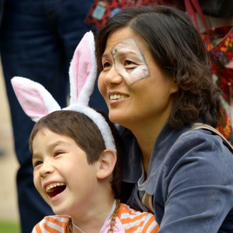 Two attendees with White Rabbit ears, and face paint